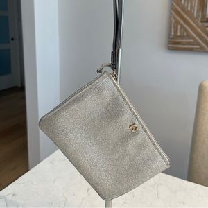 KATE SPADE WRISTLET. (#2014) SILVER METALLIC. Excellent Condition.